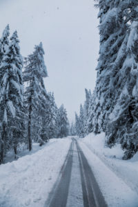 Snow covered mountain road through the forest, passo Tre Croci, Dolomites, Belluno, Italy Snow covered mountain road through the forest, passo Tre Croci, Dolomites, Belluno, Italy